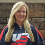 A young female with blonde hair wearing a USA sweatshirt.